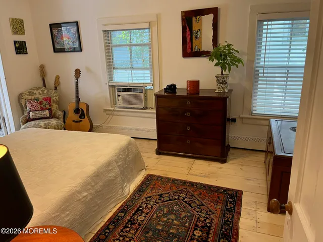 a view of a house with yard and sitting area