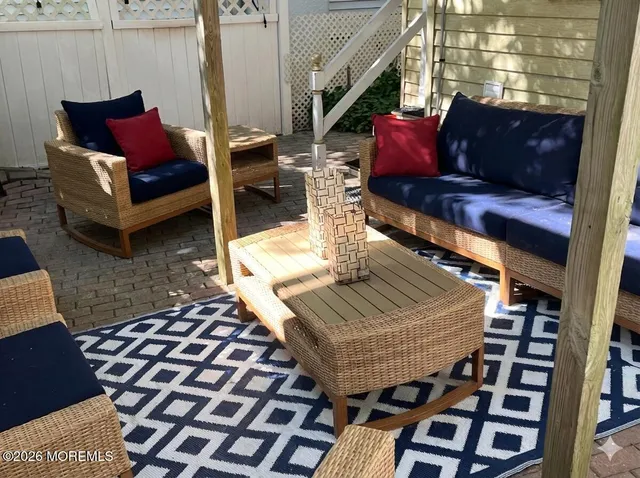 a living room with furniture and a rug