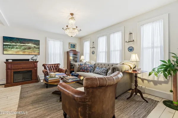 a view of a kitchen with stainless steel appliances and refrigerator