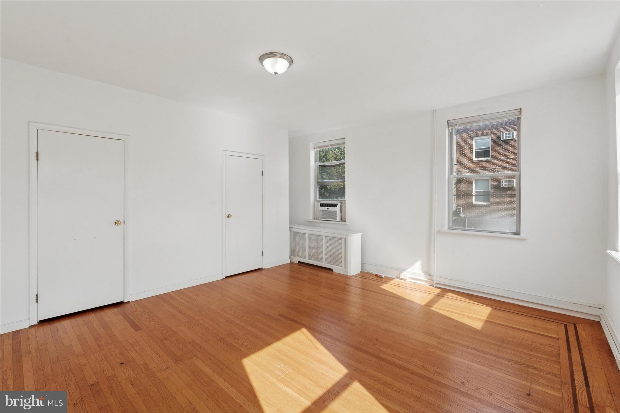 1710 South 10th Street, Unit 2 Philadelphia, PA 19148 - Photo 5 of 15 a view of an empty room with wooden floor