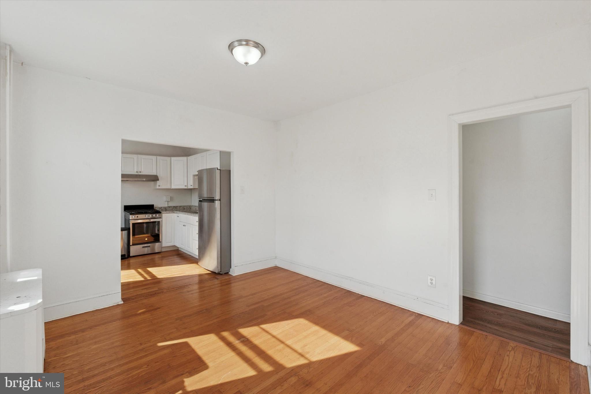 1710 South 10th Street, Unit 2 Philadelphia, PA 19148 - Photo 9 of 15 a view of empty room with wooden floor