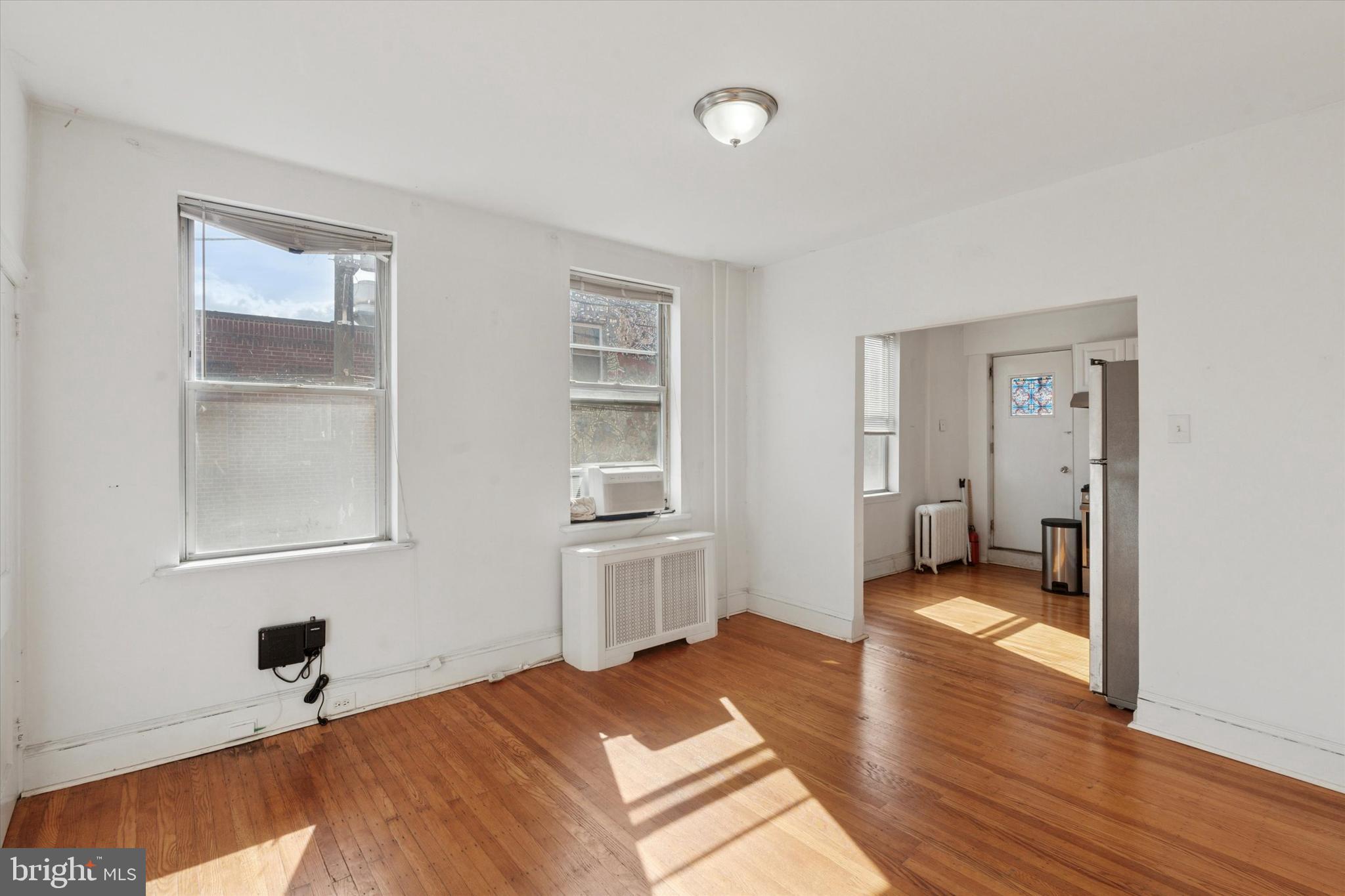 1710 South 10th Street, Unit 2 Philadelphia, PA 19148 - Photo 10 of 15 a bedroom with a bed and a window