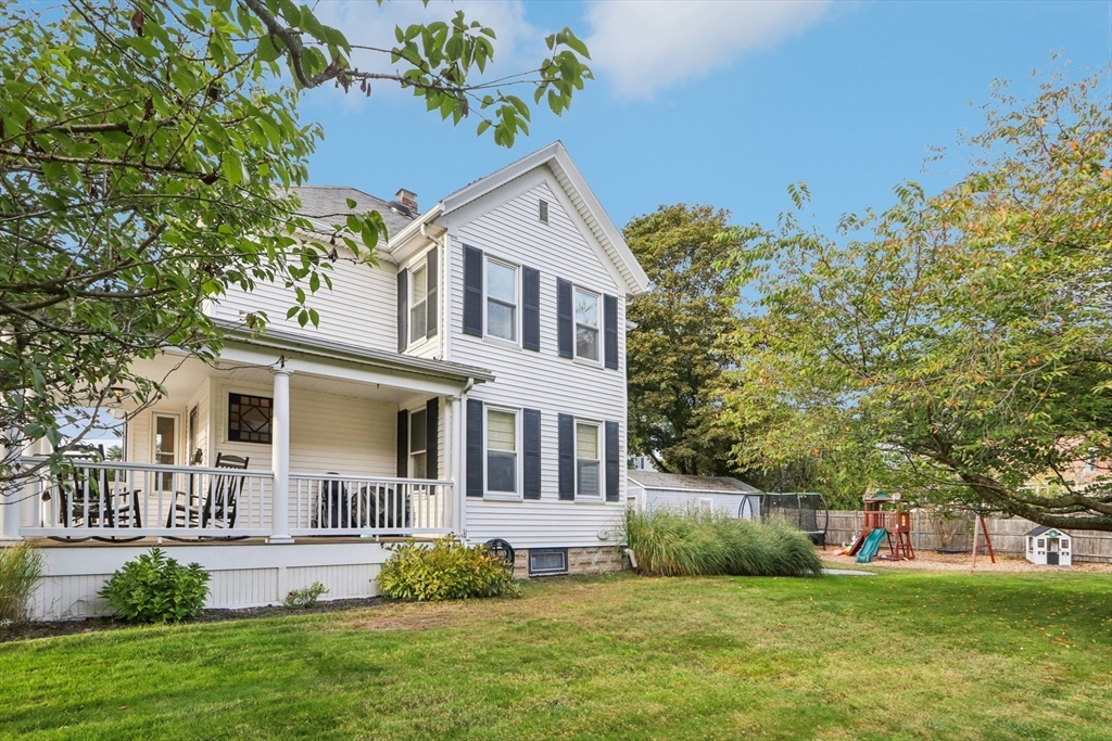 a front view of house with yard and green space