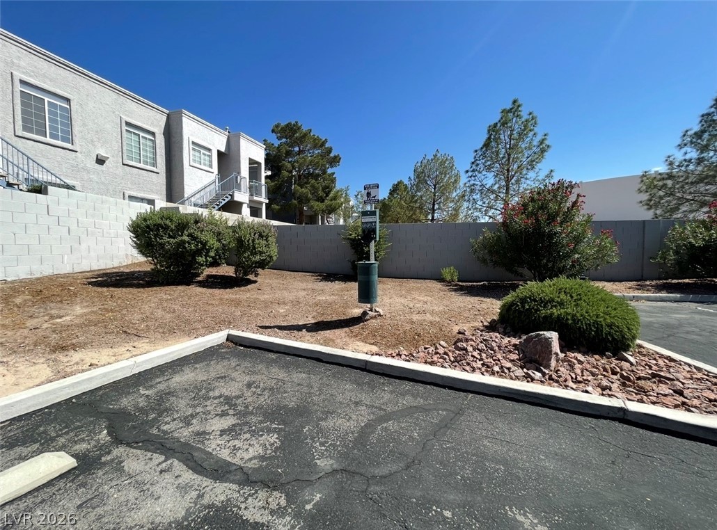 2201 Ramsgate Drive, Unit 915 Henderson, NV 89074 - Photo 14 of 36 A well-maintained parking area and landscaping enhance this property's exterior appeal.