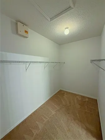 a view of a room with racks on the wall