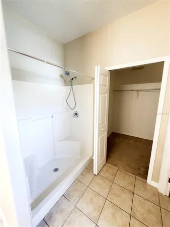 a bathroom with a bath tub and shower