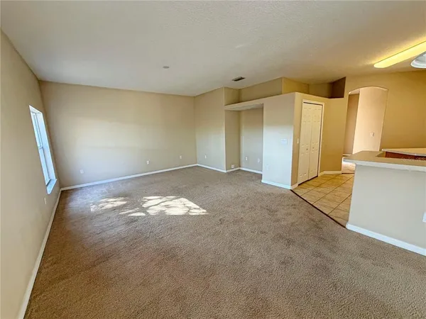 a view of a big room with closet and wooden floor
