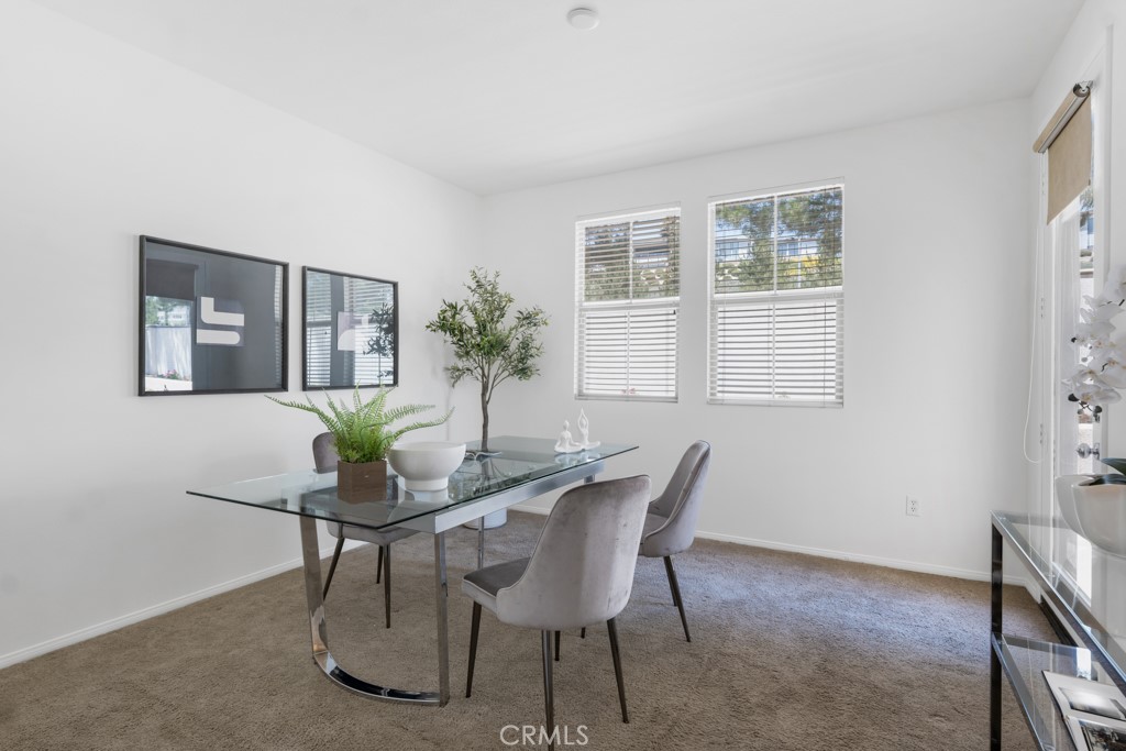 20317 Livorno Porter Ranch Porter Ranch, CA 91326 - Photo 12 of 33 a dining room with furniture and window