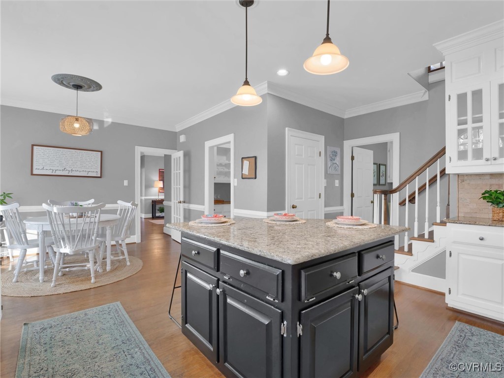 5304 Clipper Cove Road Midlothian, VA 23112 - Photo 23 of 50 a room with lots of table chairs and wooden floor