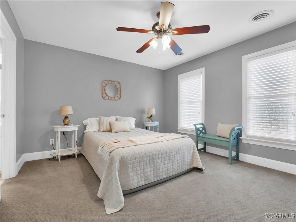 5304 Clipper Cove Road Midlothian, VA 23112 - Photo 26 of 50 a bedroom with a bed and a chandelier