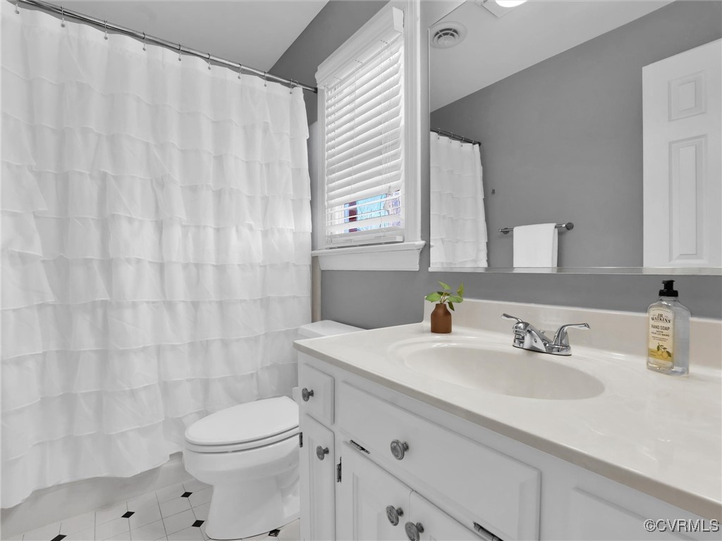 5304 Clipper Cove Road Midlothian, VA 23112 - Photo 27 of 50 a bathroom with a sink a toilet and a mirror