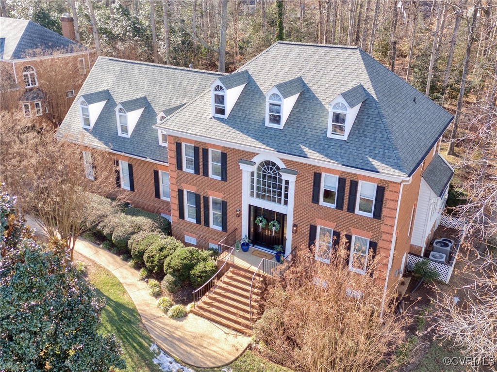 5304 Clipper Cove Road Midlothian, VA 23112 - Photo 47 of 50 a view of a brick building next to a yard