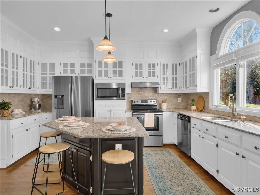 5304 Clipper Cove Road Midlothian, VA 23112 - Photo 5 of 50 a kitchen with stainless steel appliances granite countertop a stove top oven a refrigerator a sink and a island