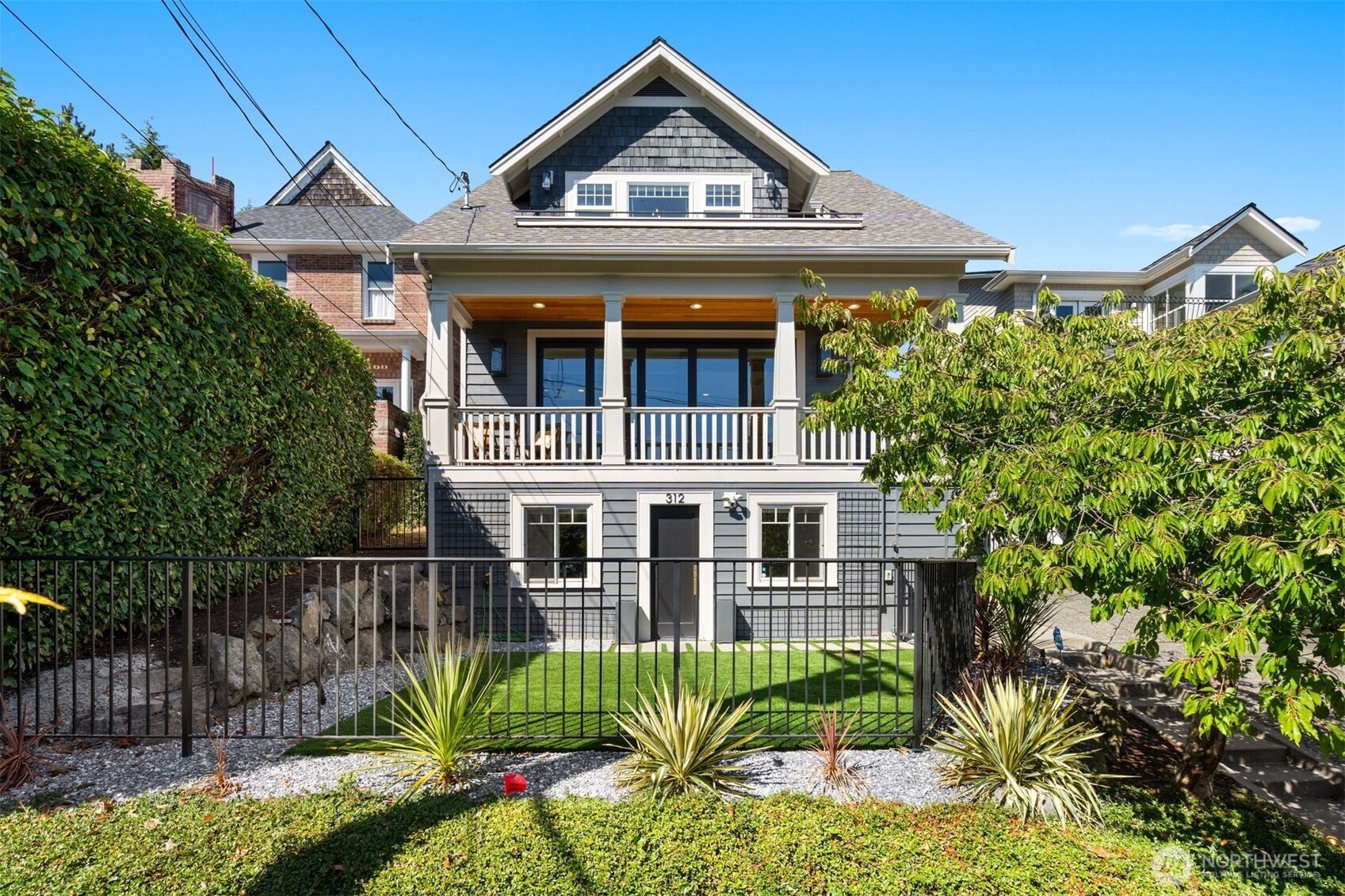 312 Prospect Street Seattle, WA 98109 - Photo 1 of 40 a front view of a house with garden