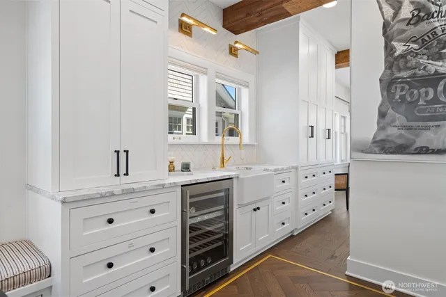 a bathroom with mirror cabinets and window