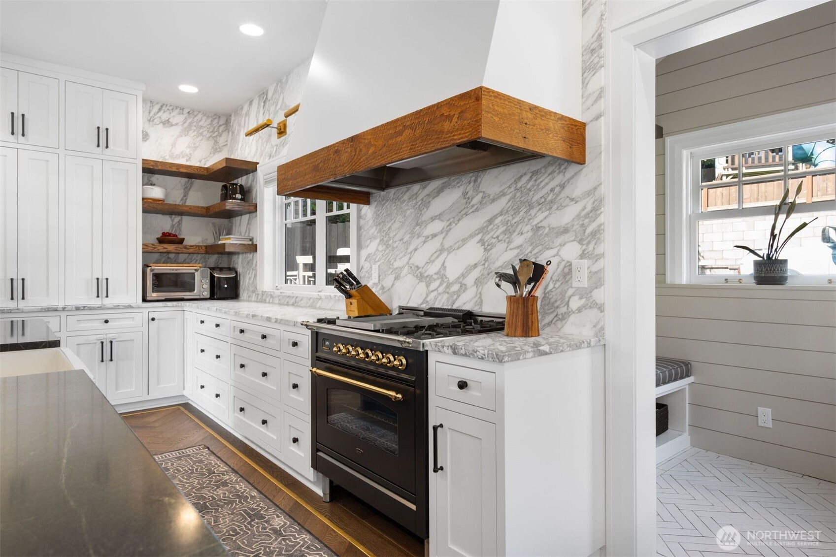 312 Prospect Street Seattle, WA 98109 - Photo 17 of 40 a kitchen with stainless steel appliances a stove a sink and a refrigerator