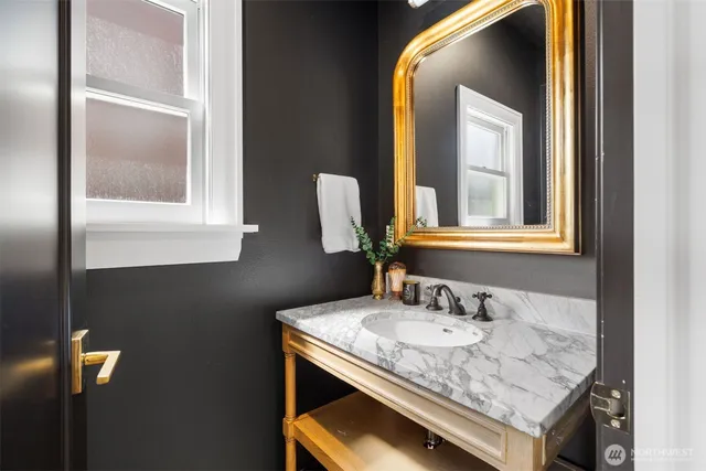 a bathroom with a sink and a mirror
