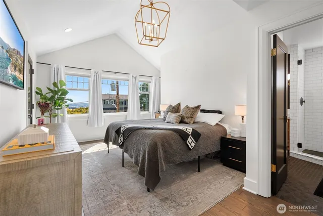 a bed room with a bed and window