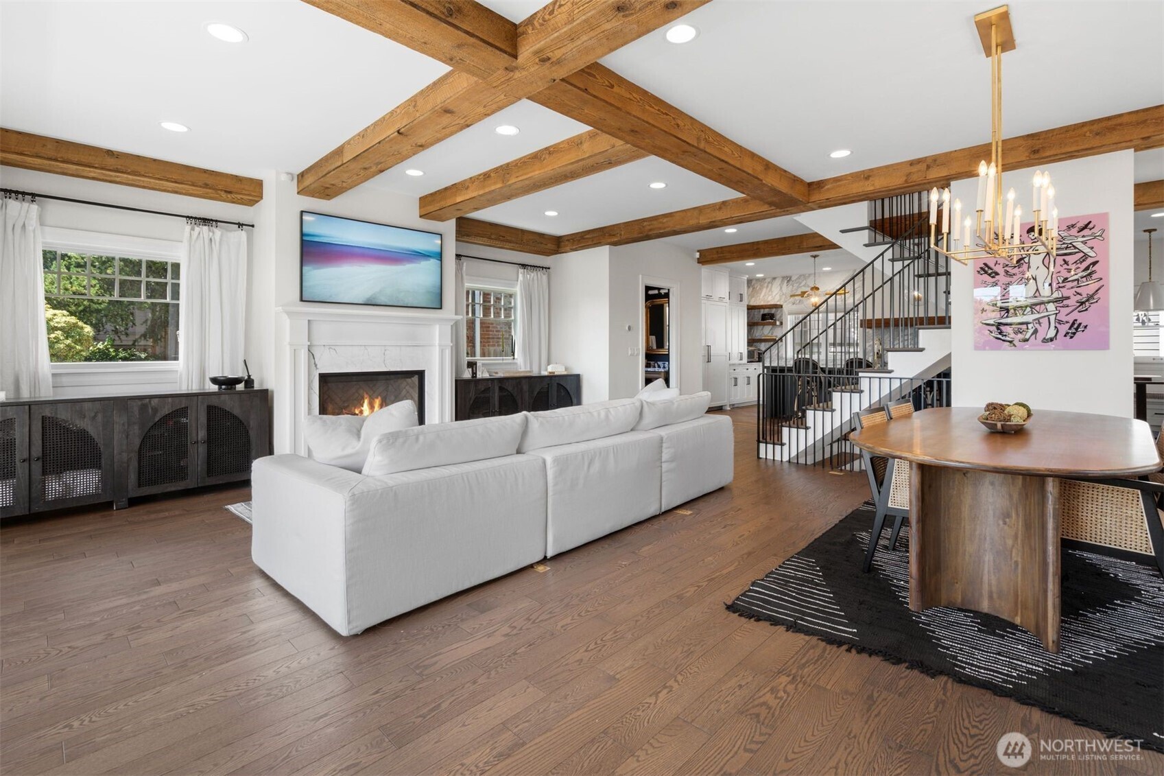 312 Prospect Street Seattle, WA 98109 - Photo 3 of 40 a living room with furniture large window and a fireplace