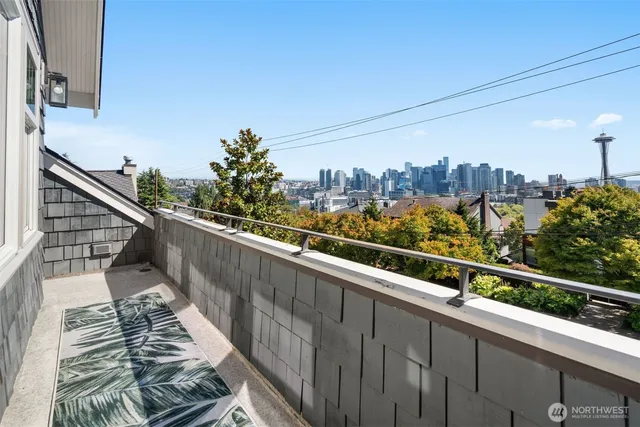 a view of balcony with wooden floor and fence