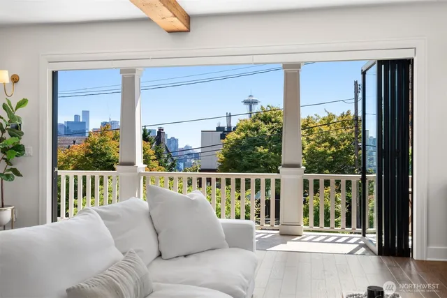 a balcony with furniture and potted plants