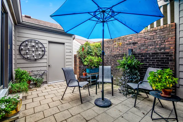 a view of a backyard with furniture and a patio