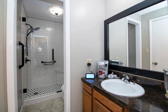 a bathroom with a sink and a mirror