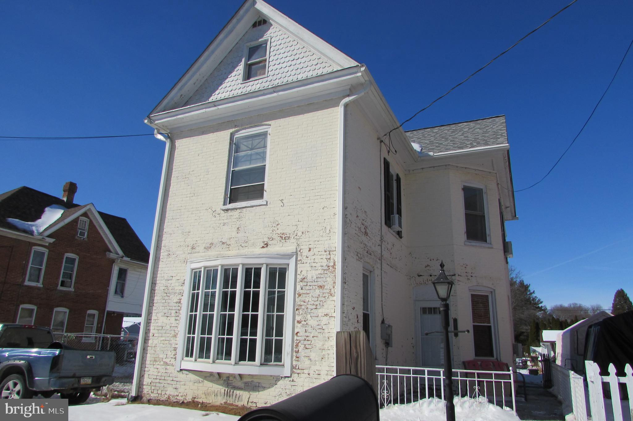 412 South Potomac Street Waynesboro, PA 17268 - Photo 43 of 46 a front view of a house with a blue gate