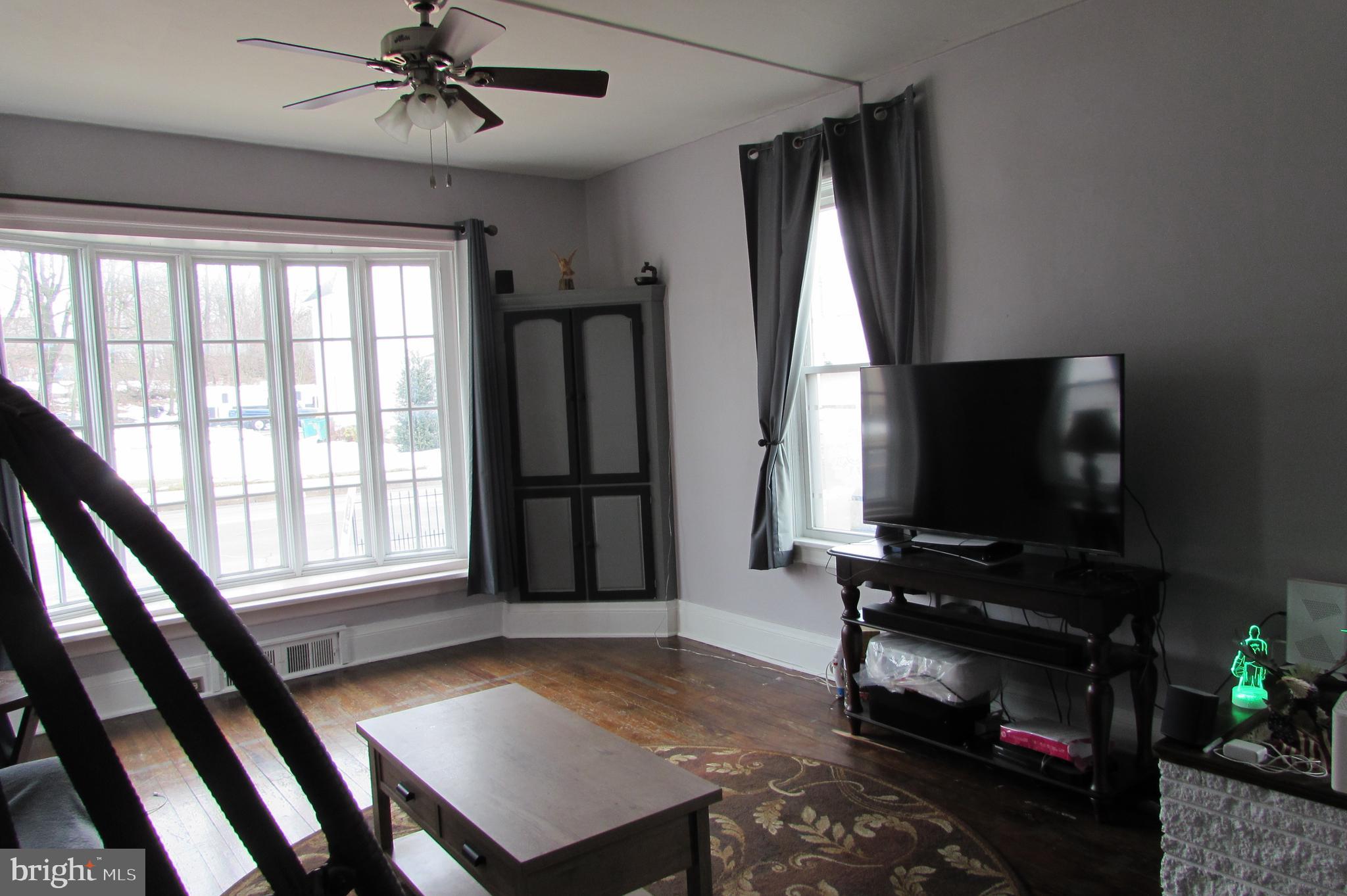412 South Potomac Street Waynesboro, PA 17268 - Photo 8 of 46 a living room with furniture a flat screen tv and a window