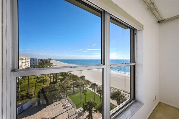 a view of balcony with a floor to ceiling window and wooden floor