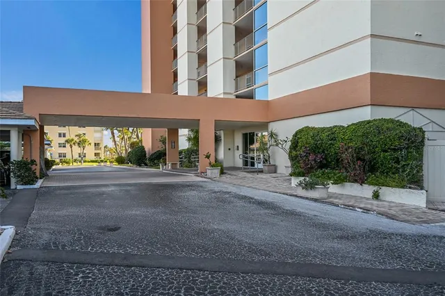 a view of a large room with wooden floor and a hallway