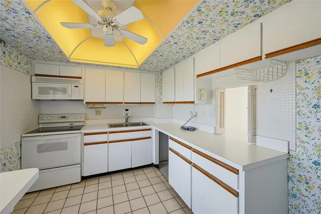 a bathroom with a sink and a large mirror