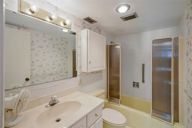 a very nice looking living room with kitchen and furniture