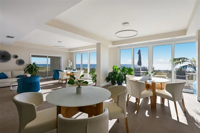 a view of a swimming pool with outdoor seating