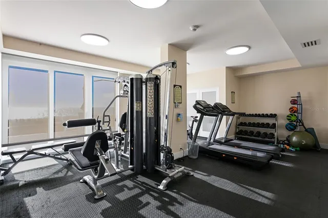 a view of a patio with a table chairs and a garden