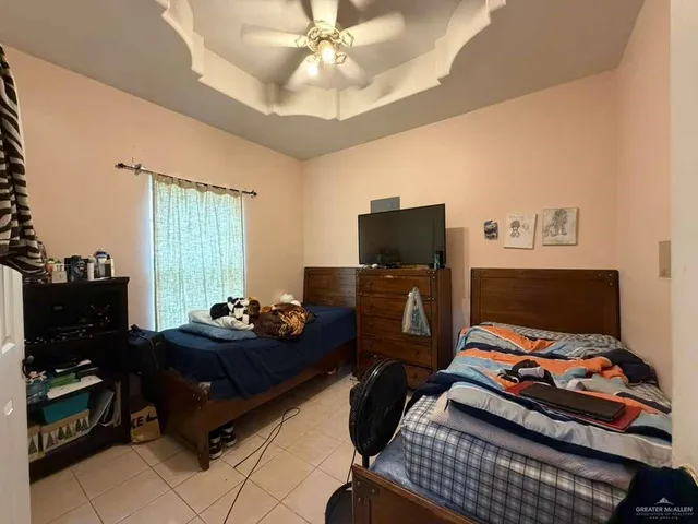 a bedroom with furniture and a window