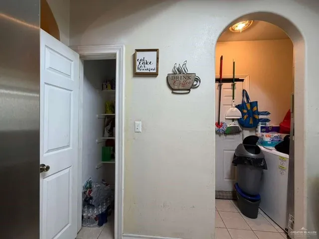 a view of a livingroom with storage and utility racks