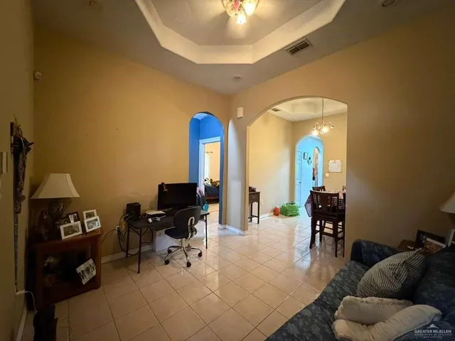 a view of a livingroom with furniture and a piano