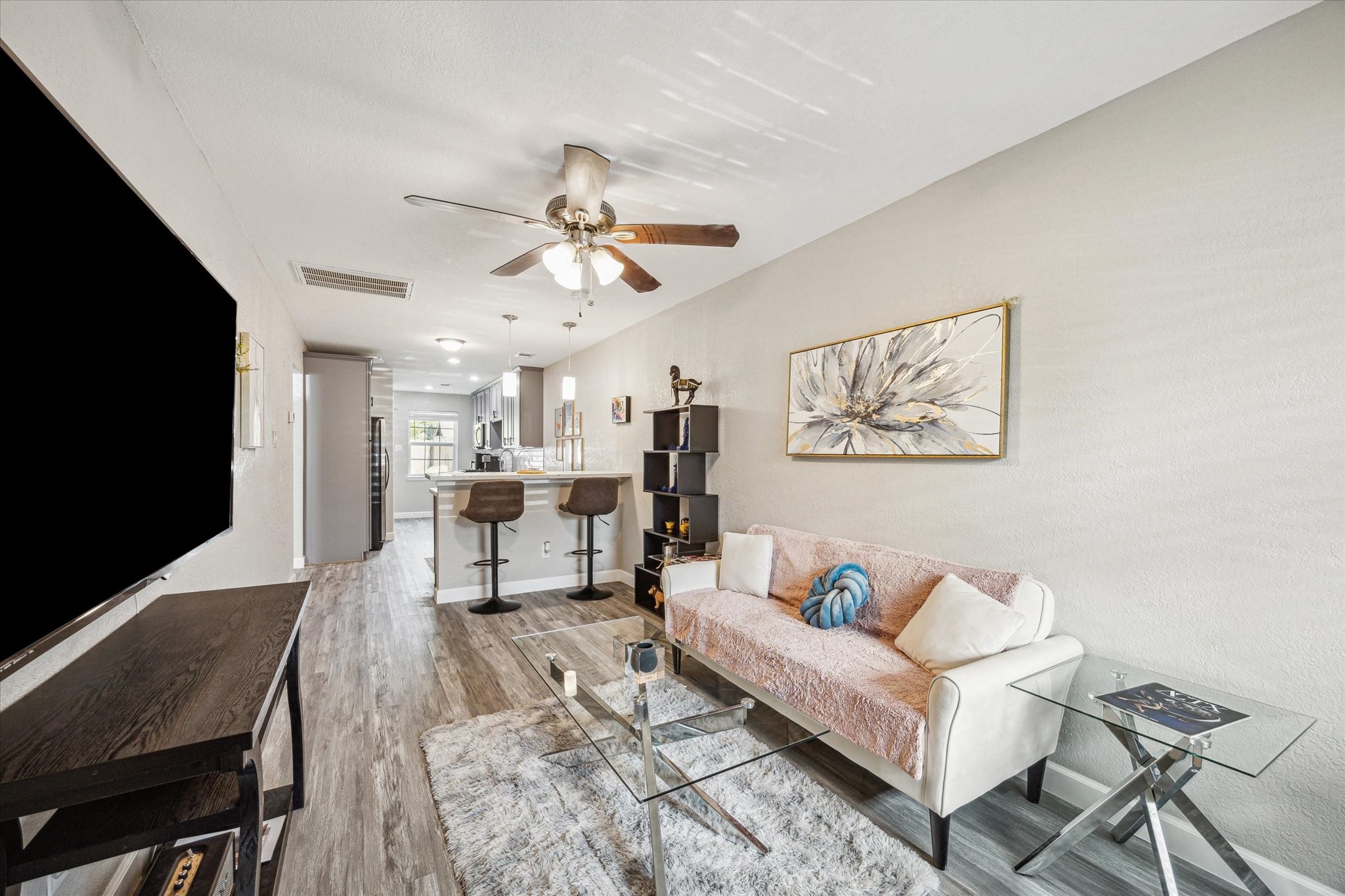 3808 Cochran Street Houston, TX 77009 - Photo 4 of 14 a living room with furniture and a flat screen tv