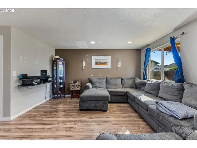 a living room with furniture and a table
