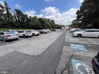 a view of street with parked cars