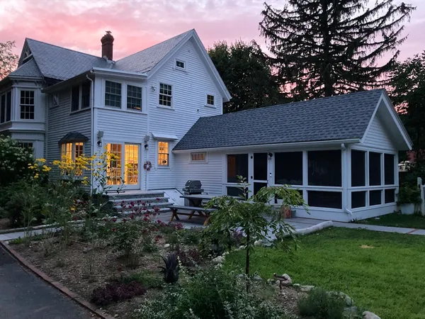a front view of a house with garden