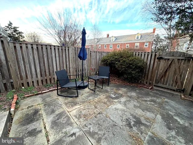 a view of backyard with a table and chair