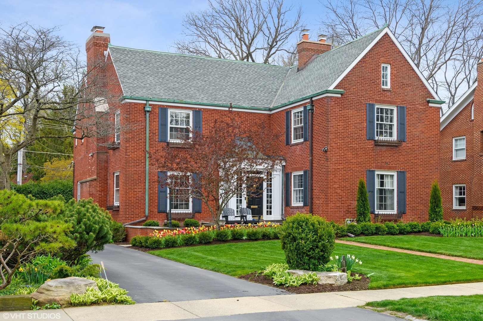 a front view of a house with garden