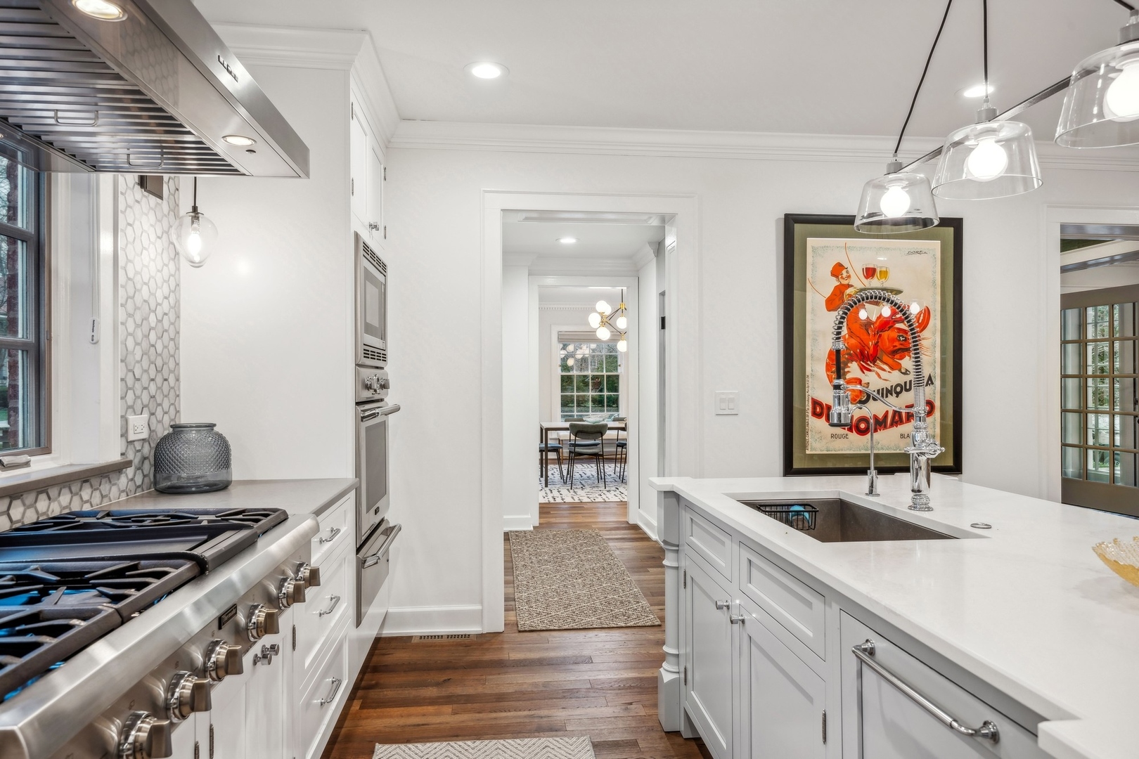78 Robsart Road Kenilworth, IL 60043 - Photo 13 of 44 a kitchen with stainless steel appliances granite countertop a sink and a stove