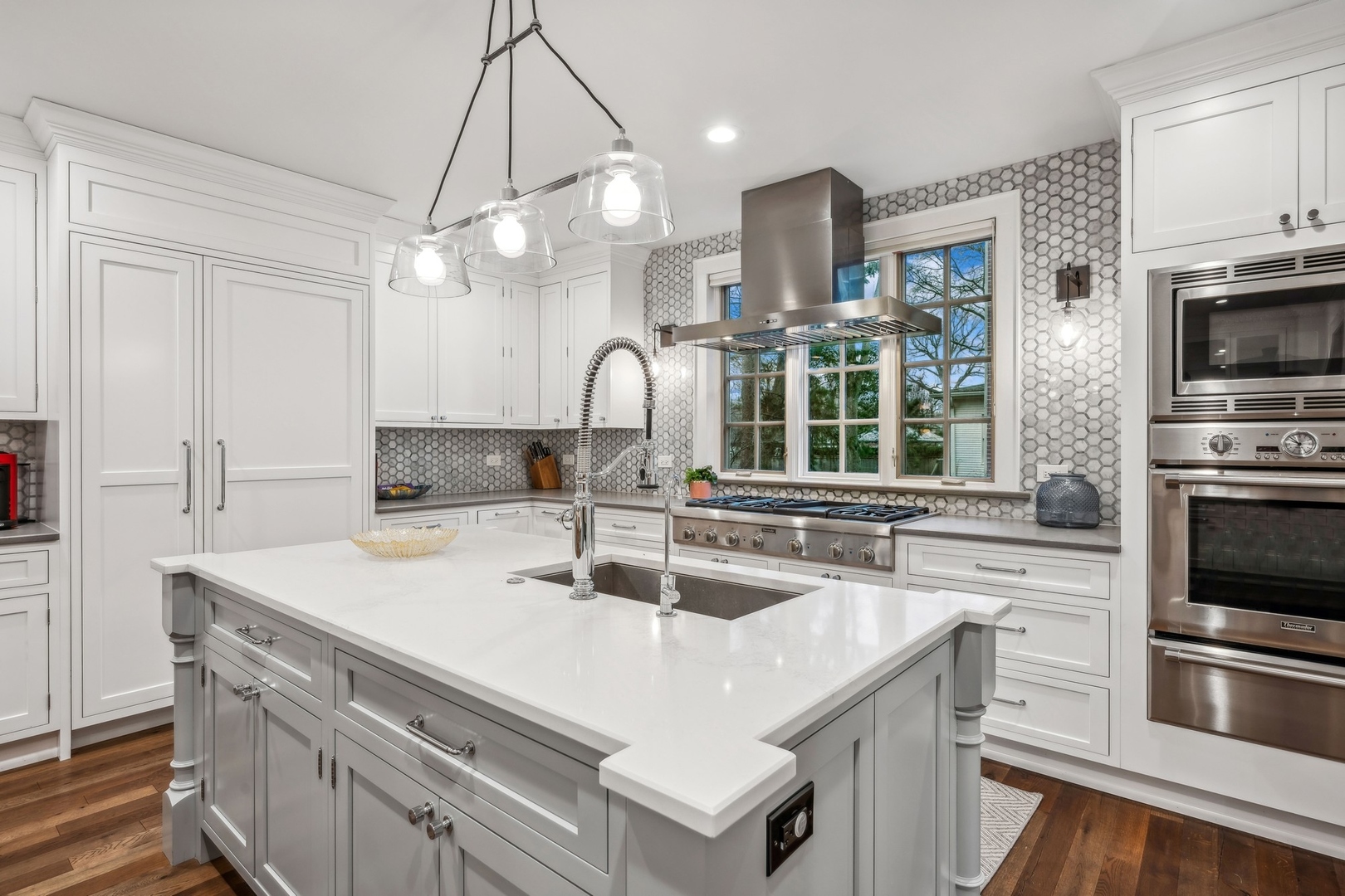 78 Robsart Road Kenilworth, IL 60043 - Photo 16 of 44 a kitchen with kitchen island a sink appliances and cabinets