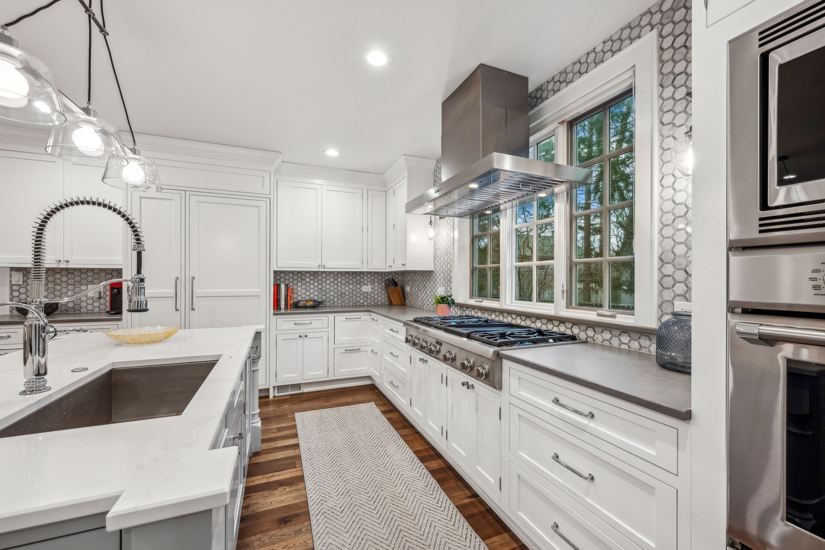 78 Robsart Road Kenilworth, IL 60043 - Photo 17 of 44 a kitchen with a stove a sink and a refrigerator