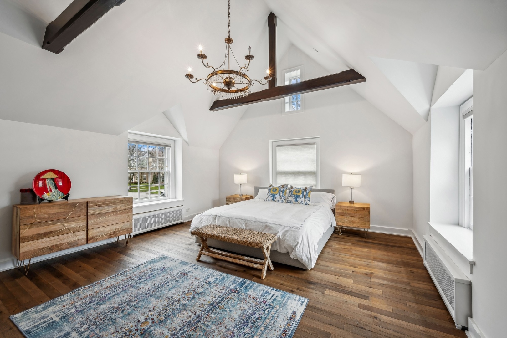 78 Robsart Road Kenilworth, IL 60043 - Photo 29 of 44 a bedroom with a bed and a chandelier