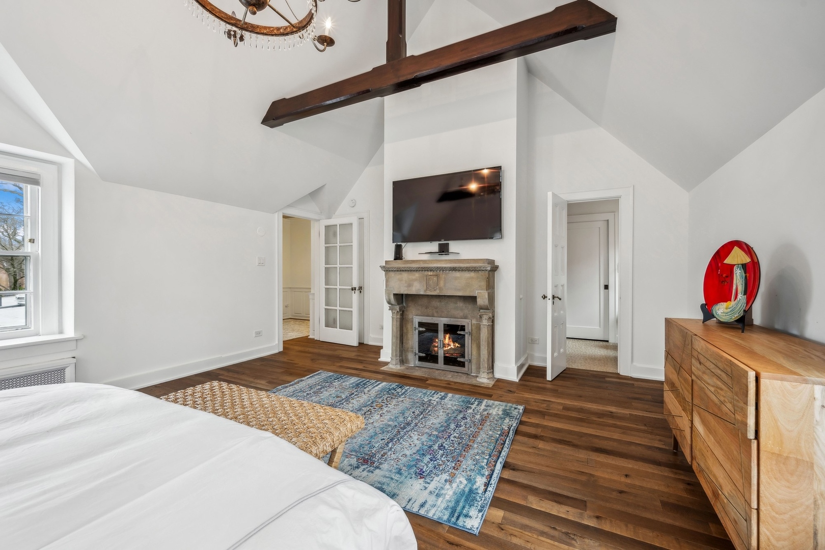 78 Robsart Road Kenilworth, IL 60043 - Photo 30 of 44 a bedroom with a bed and a flat screen tv