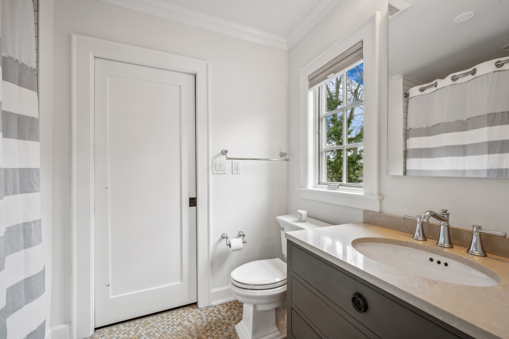 78 Robsart Road Kenilworth, IL 60043 - Photo 31 of 44 a bathroom with a granite countertop toilet sink and mirror